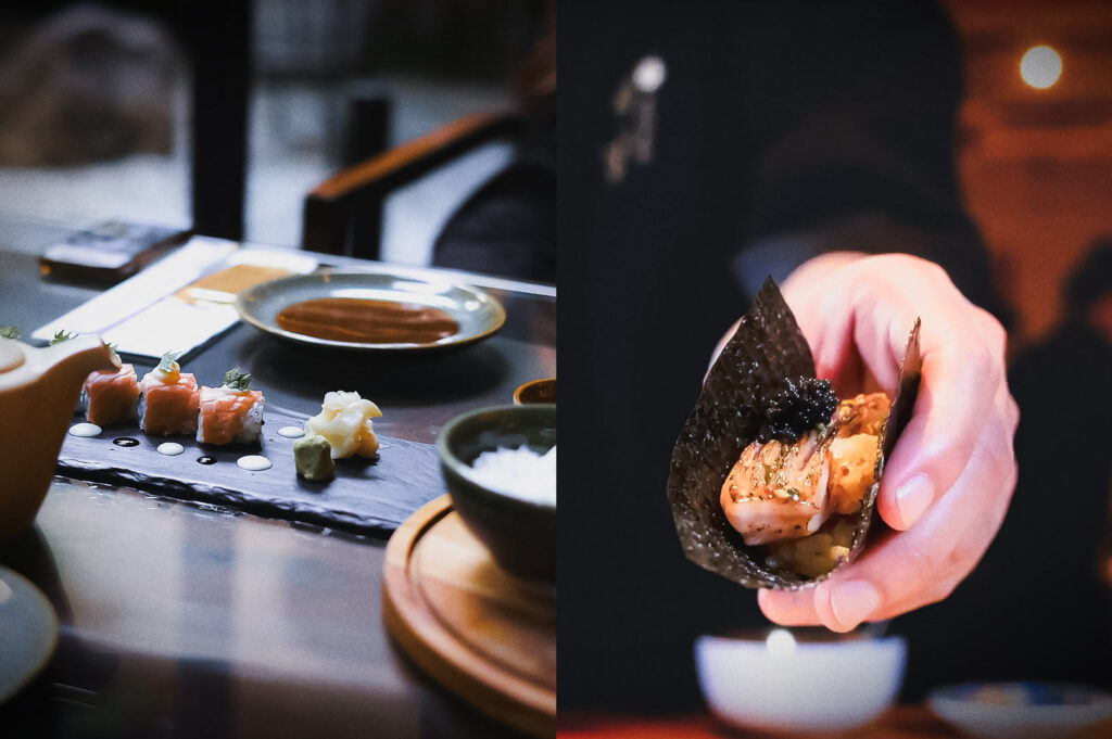 A split-screen image showing a high-end sushi dining experience. The left side features a slate platter with delicate sushi rolls and ginger, while the right side shows a close-up of a hand holding a piece of crispy seaweed topped with seared fish and garnish.